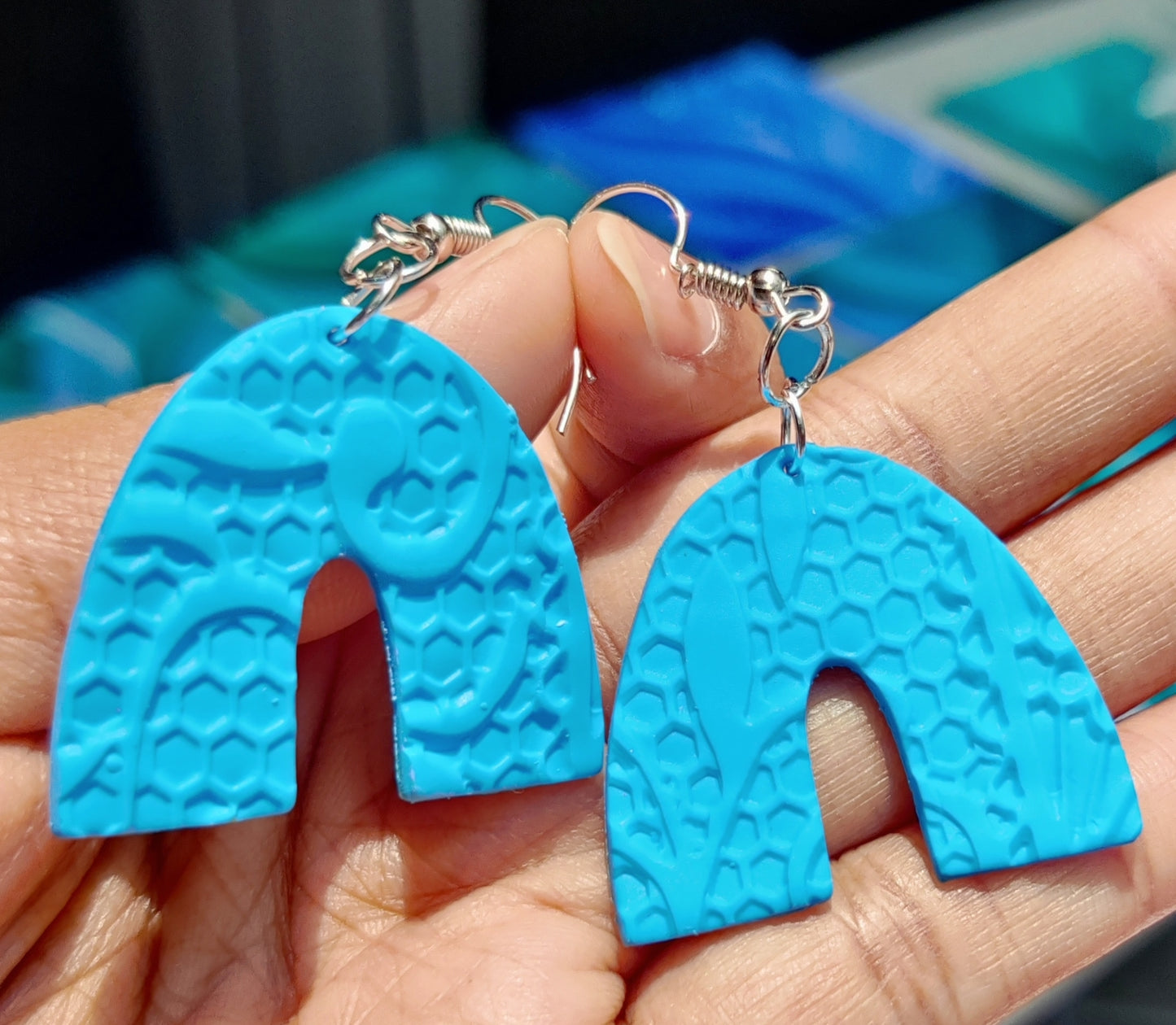 Arch dangler earring